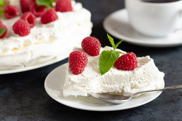 Meringue with whipped cream, raspberries.and mint