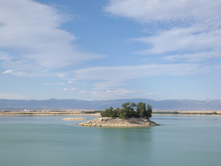 View of lake with blue sky and clouds