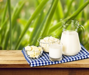 Glass of milk and bottle on  background