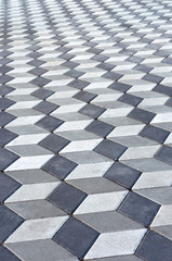 Abstract gray paving slabs. 3D effect. Optical illusion. Texture background. Close-up