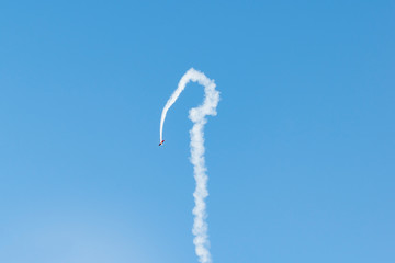 Small plane performs aerobatics in the sky