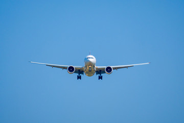 Passenger airplane in the blue sky