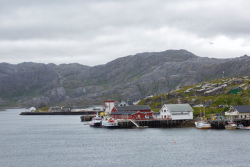 Small Norwegian village by the sea in cloudy weather