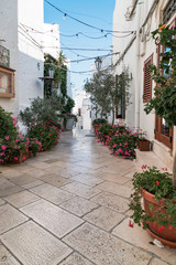 Ostuni, Italy - August 2019: Historic center of white city of Ostuni in Puglia, in a day of August