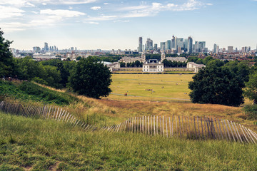 London panorama seen from Greenwich park viewpoint. Symbolic Broken fence in the foreground