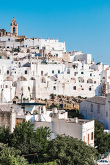 Ostuni, Italy - August 2019: Historic center of white city of Ostuni in Puglia, in a day of August