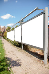 advertising board on asphalt road
