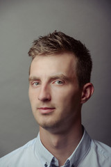 Obraz premium Portrait of a smart serious young man