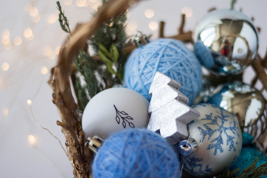 2020. Blue Christmas balls with pictures in the gold basket. Balls to decorate the tree. Design. Background.3d toys