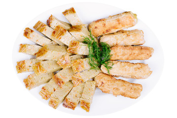 Sliced casserole with pasta with meat in a plate isolated
