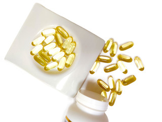 Omega 3 spilled from the jar. Fish oil.