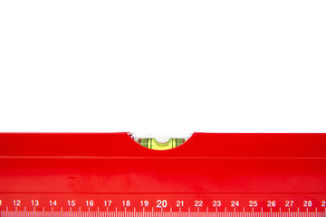 Red spirit level isolated on a white background. The concept of building a house, doing home renovations. Getting the right level, attention to detail.