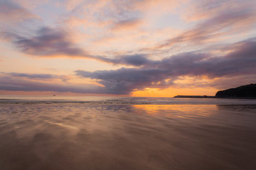 a beautiful sunrise on the beach of La Salve, in Laredo, cantabria