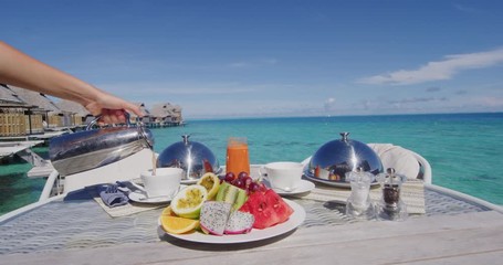 Vacation breakfast table at luxury restaurant or hotel room by the water in the tropics. Romantic honeymoon travel holiday. - Powered by Adobe
