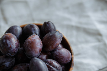 Plum in wood plate
