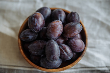 Plum in wood plate