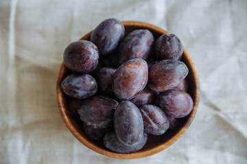 Plum in wood plate