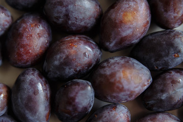 Plums macro in wood plate