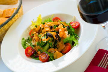 Plate of delicious salad with seafood