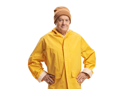 Elderly man in a yellow raincoat wearing a warm hat