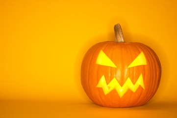 Halloween pumpkin head jack isolated on yellow background