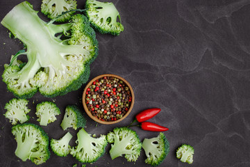 Raw broccoli on black chalkboard.Vegetables for diet and healthy eating.Free healthy vegetarian and vegan recipes.  Background with free text space.
