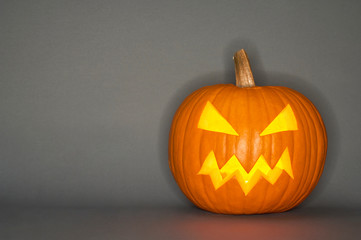 Halloween pumpkin head jack isolated on grey background