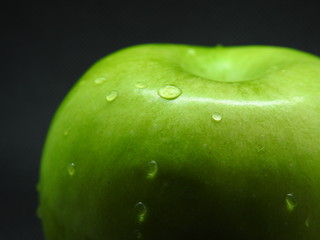 green apple with water drops
