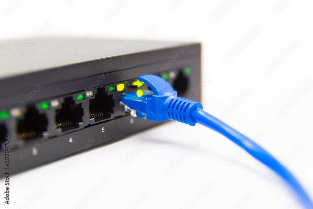 Poster the blue network cables connect port switch on white table concept internet network connection