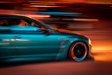 Obraz na płótnie Canvas marina blue car racing at night