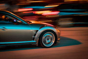grey car racing at night