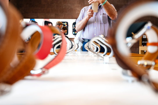 STRASBOURG, FRANCE - SEP 21, 2018: Apple Store With Senior Male Customer Admiring The New Latest Watch Series 4 Wearable Devices With Diverse Straps Taking Photo On Nokia Smartphone