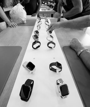 STRASBOURG, FRANCE - SEP 21, 2018: Black and white image of Apple Store with customers people buying admiring the new latest Watch Series 4 wearable smartwatch