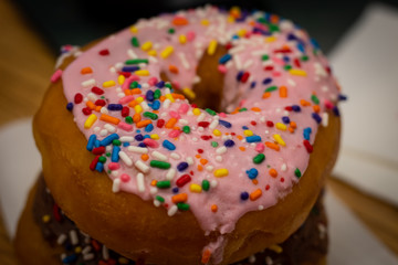 Close Up Iced Donuts on a Desk