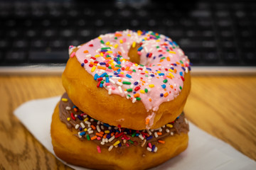 Close Up Iced Donuts on a Desk