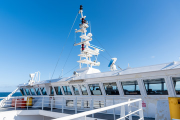 Naklejka premium Control bridge of a ferry boat in navigation on a cloudless spring day