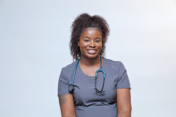 Portrait of a young attractive African American woman, a happy young nurse  - 292050425