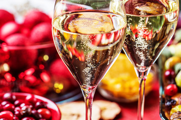 Christmas themed dinner table with christmas duck and champagner  