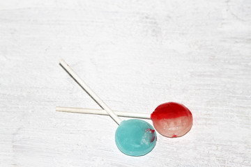 Fototapeta na wymiar Blue and red and white lollipops on white background