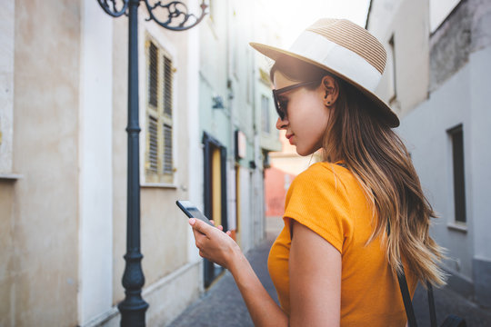 Female backpacker with smartphone