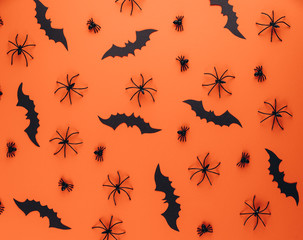 Halloween concept. Decorations on the orange background. Flat lay, top view, copy space