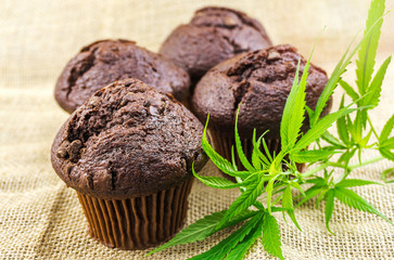 Cannabis cupcake muffins and Hemp leaves on hemp burlap
