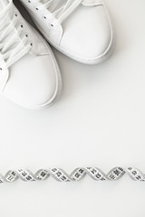 Stylish white fashion sneakers on white background.