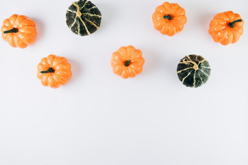 Pumpkins on a white background. Autumn, fall, halloween concept. Flat lay, top view, copy space