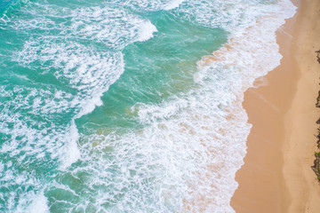 Sea wave on white sand beach turqouise water