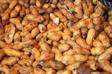 A background of roasted peanuts at the local farmers market.