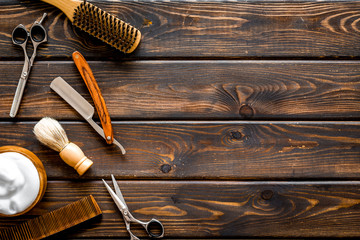 Barbershop concept. Hairdressing tools on dark wooden background top view space for text - obrazy, fototapety, plakaty