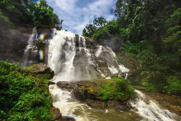 Natural blurred background of waterfalls, fast-flowing currents and water droplets from the wind...