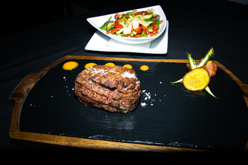 a prime Argentinian sirloin steak cooked to perfection served with some sautéed vegetables 