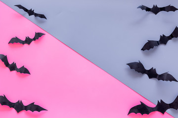 Bats cutout on Halloween frame on pink and blue table top view space for text